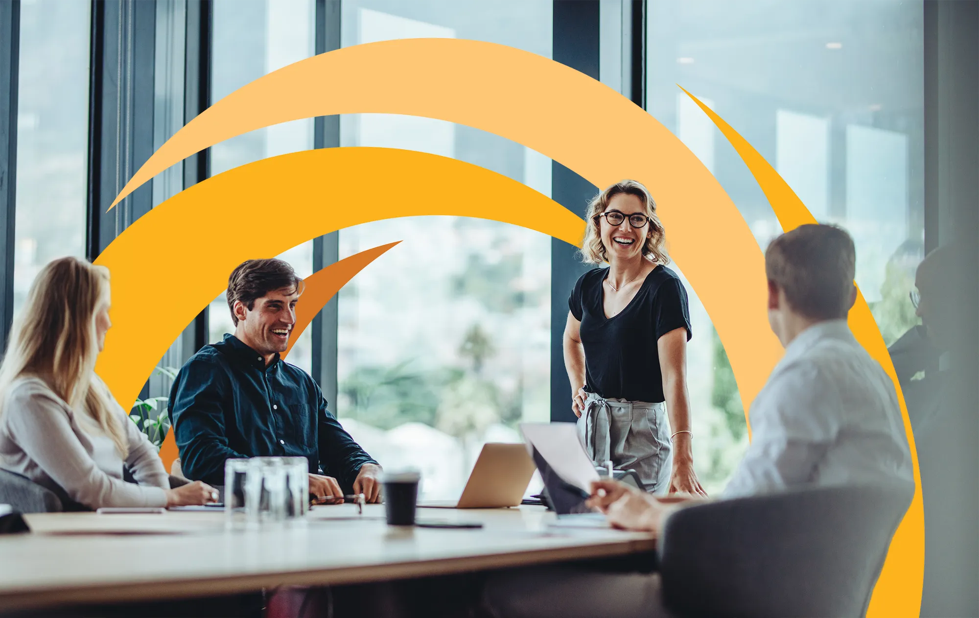 Workers meet at conference room table